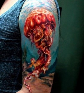 Colourful jellyfish arm tattoo