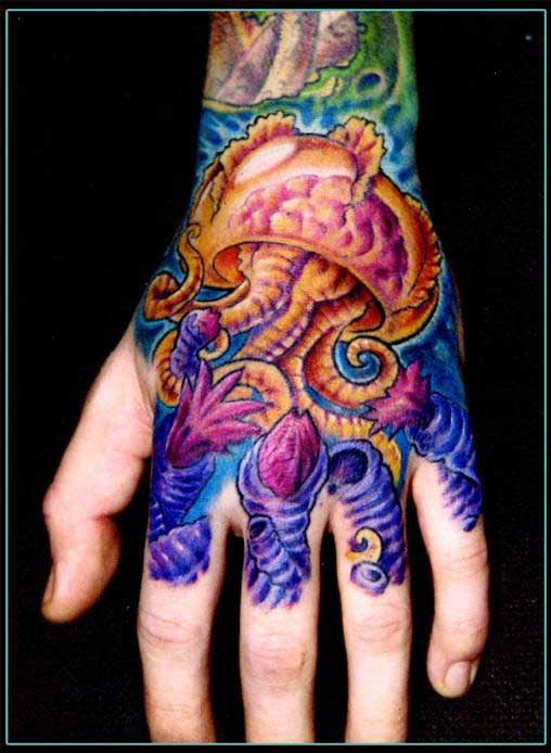 Colourful jellyfish hand tattoo