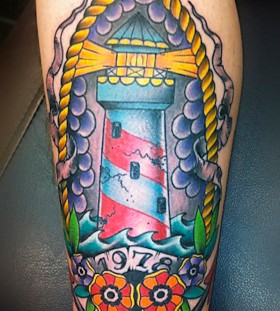 Colourful lighthouse arm tattoo