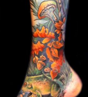 Colourful mushroom and frog leg tattoo