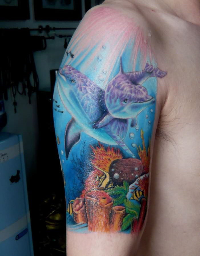 Colourful ocean and dolphins tattoo