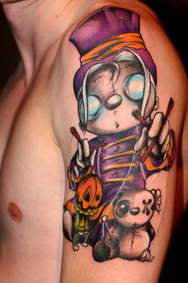 Colourful puppet master arm tattoo