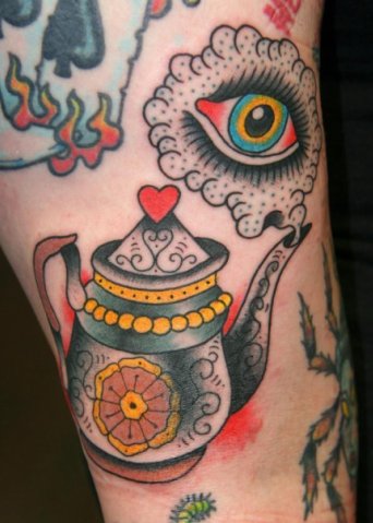 Colourful teapot and eye tattoo