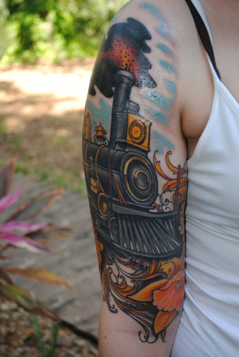 Colourful train arm tattoo