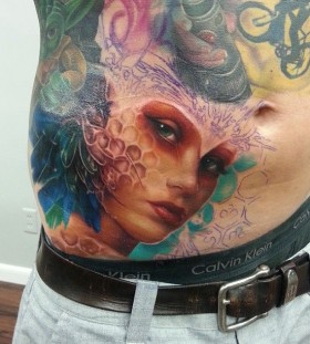 Colourful woman tattoo by Kyle Cotterman
