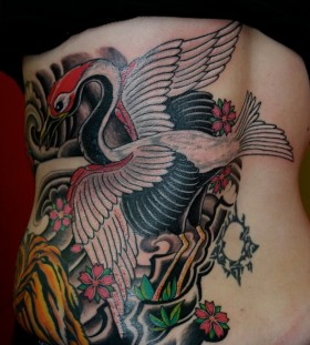 Cool crane and flowers tattoo