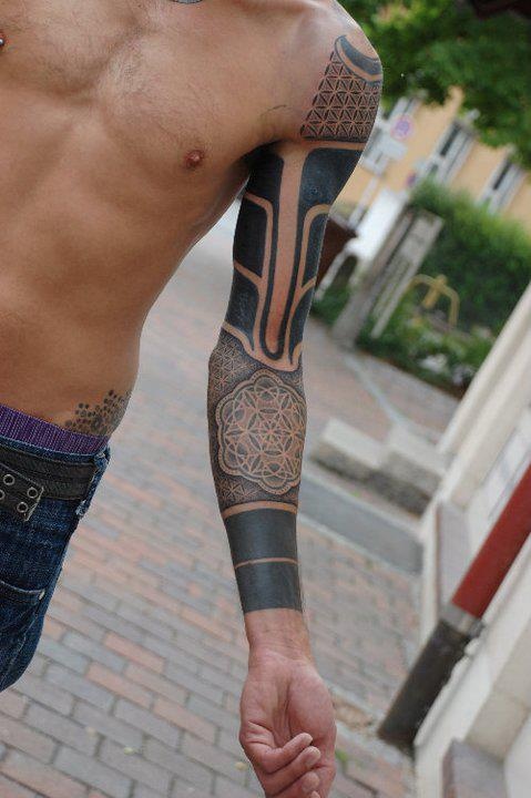 Cool full arm tattoo by Gerhard Wiesbeck