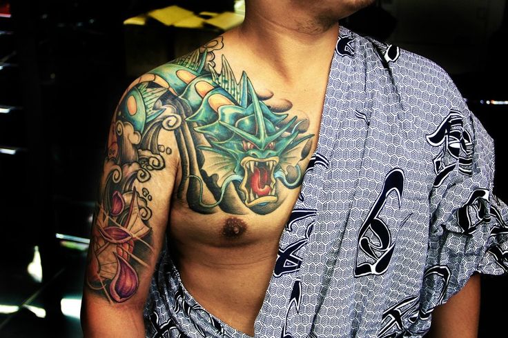 Cool pokemon arm and chest tattoo