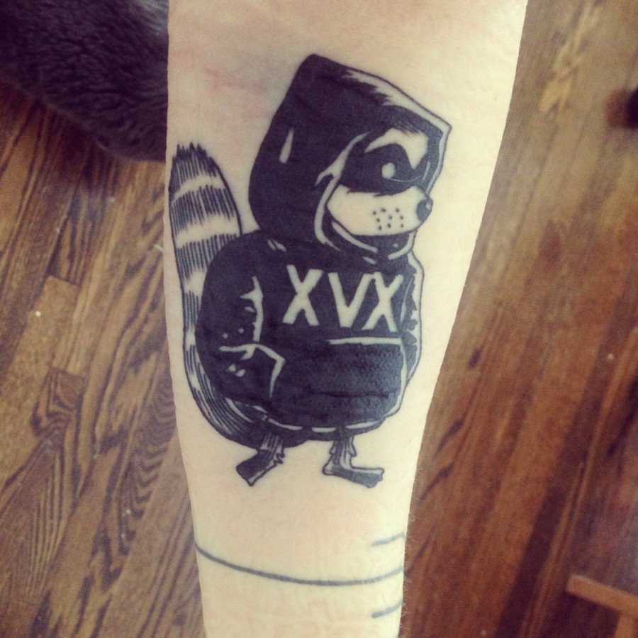 Cool raccoon arm tattoo