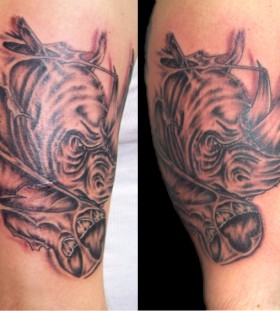 Cool rhino arm tattoo