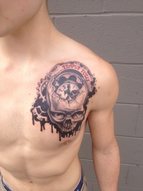 Cool skull clock chest tattoo