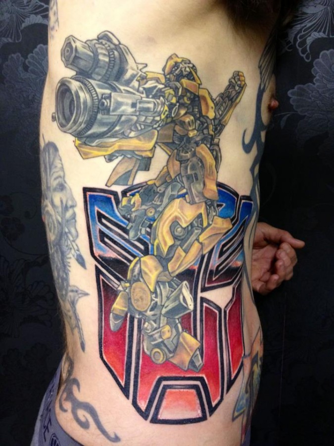 Cool transformers side tattoo