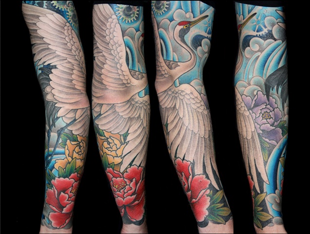 Crane and flowers tattoo