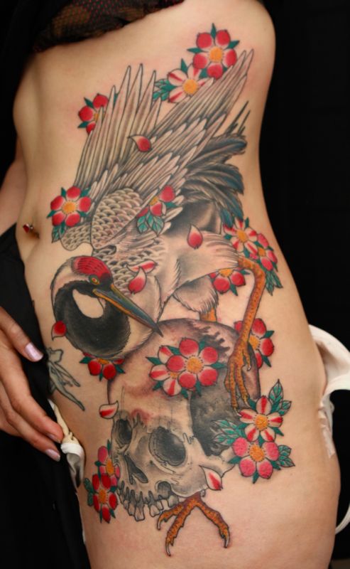 Crane and skull tattoo