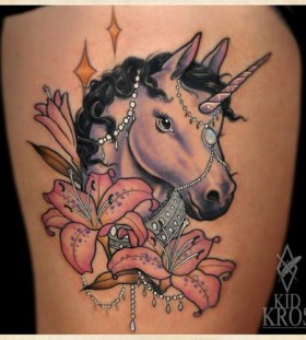 Crazy looking unicorn tattoo