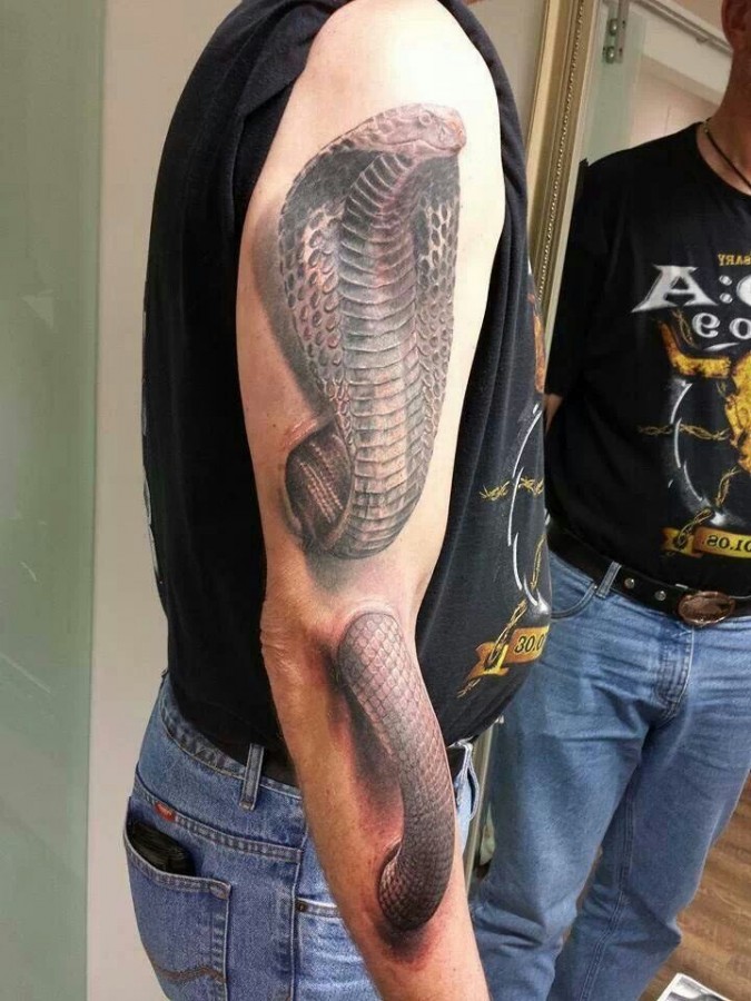 Creative cobra arm tattoo