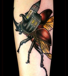 Creative flying bug tattoo