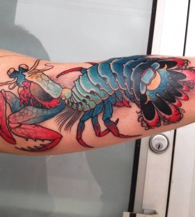 Creative lobster arm tattoo