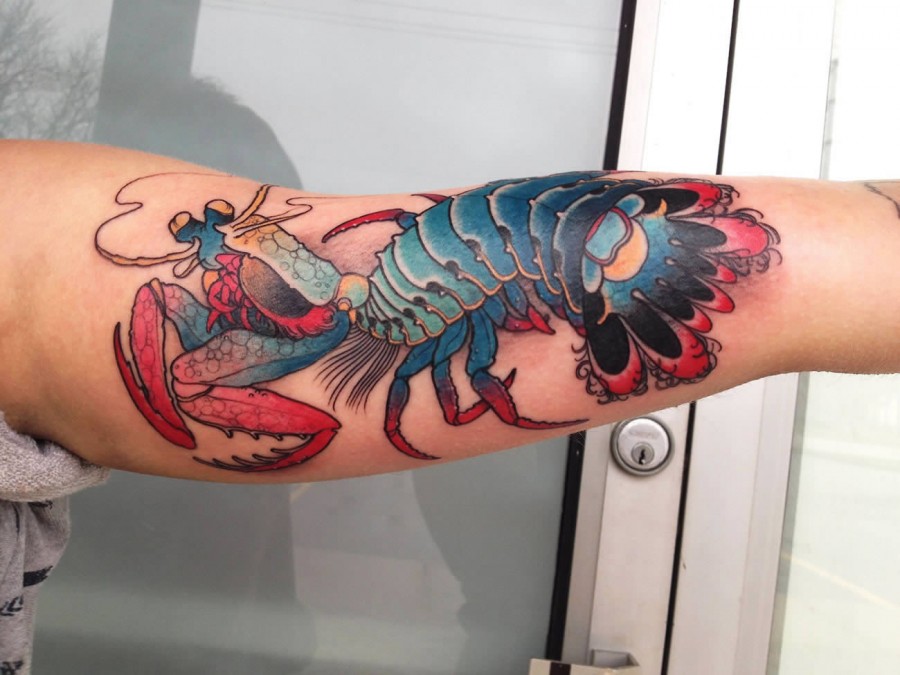 Creative lobster arm tattoo