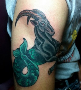Custom seagoat arm tattoo