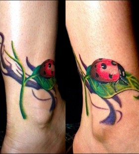 Cute ladybug and leaf tattoo