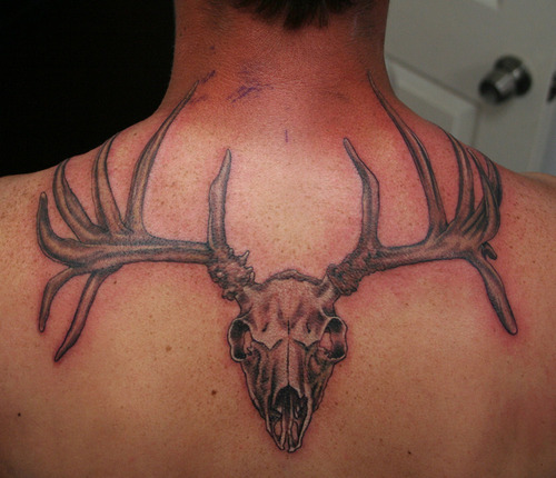 Deer skull back tattoo