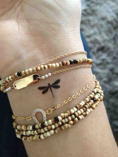 Diminutos black tiny tattoo