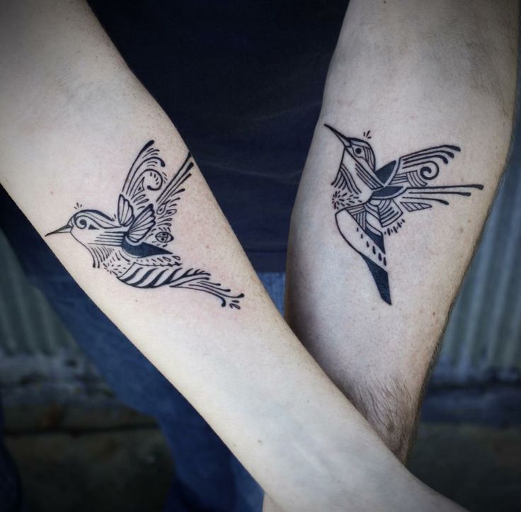 Double black tribal bird tattoo