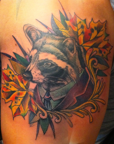 Dressed up raccoon tattoo