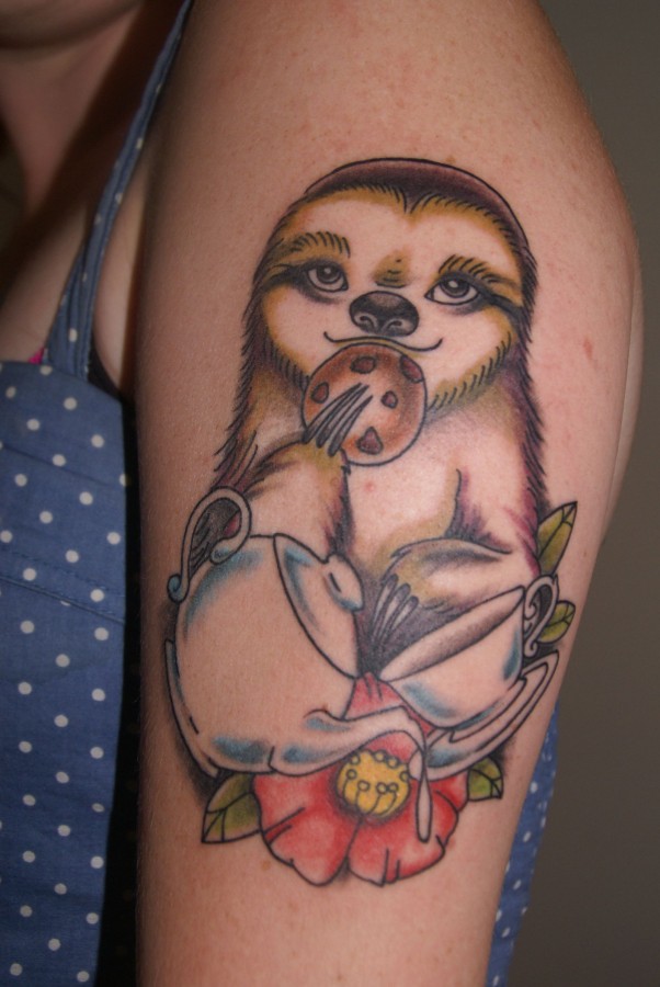 Eating sloth arm tattoo