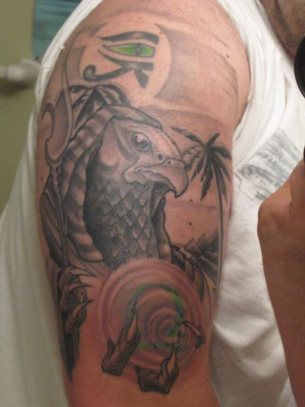 Egyptian god horus arm tattoo