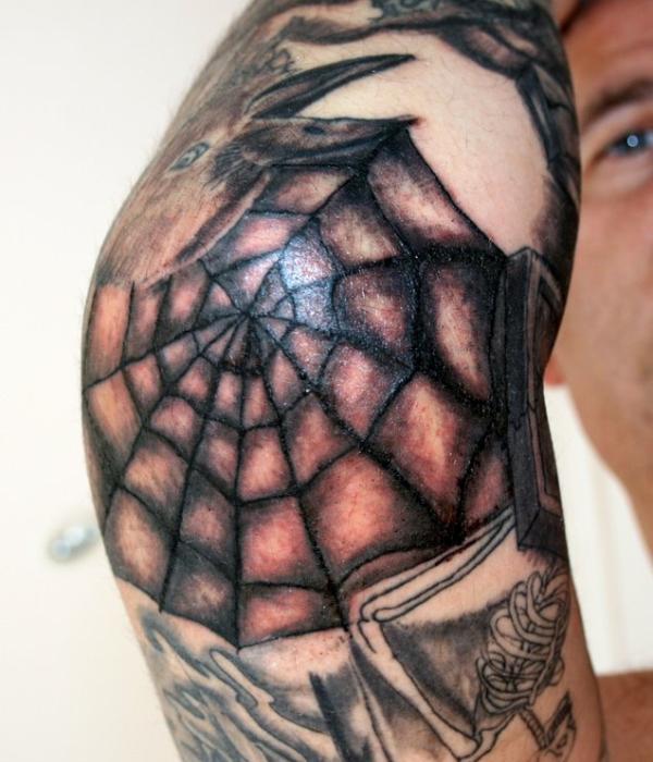 Elbow spider web tattoo