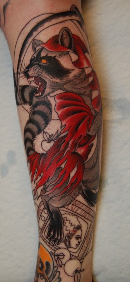 Evil raccoon arm tattoo