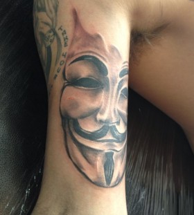 Face of V arm tattoo