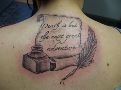 Feather pen and quote tattoo