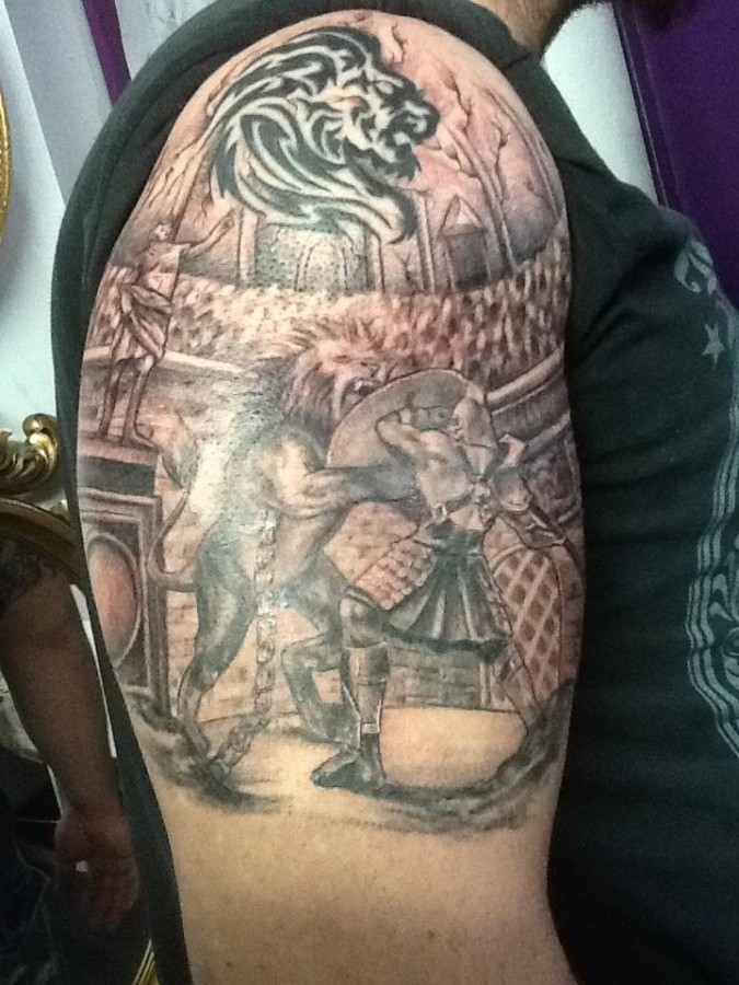 Fighting gladiator arm tattoo