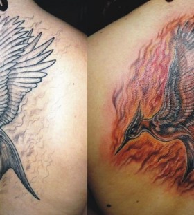 Flaming mockingjay back tattoo