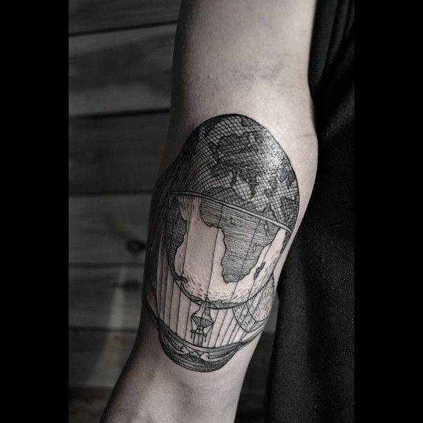 Flying globe ship tattoo by Thomas Cardiff