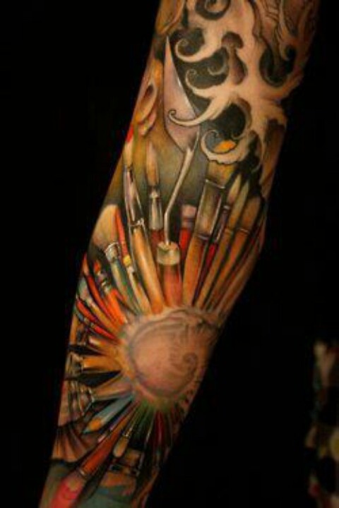 Full arm paint brush tattoo