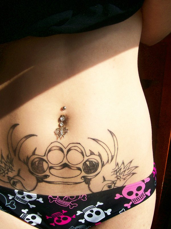 Funny stomach tattoo design