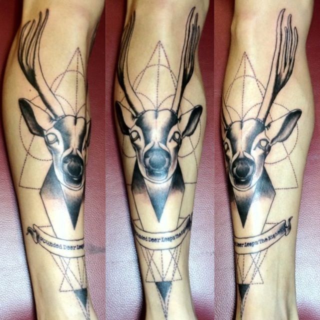 Geometric deer leg tattoo