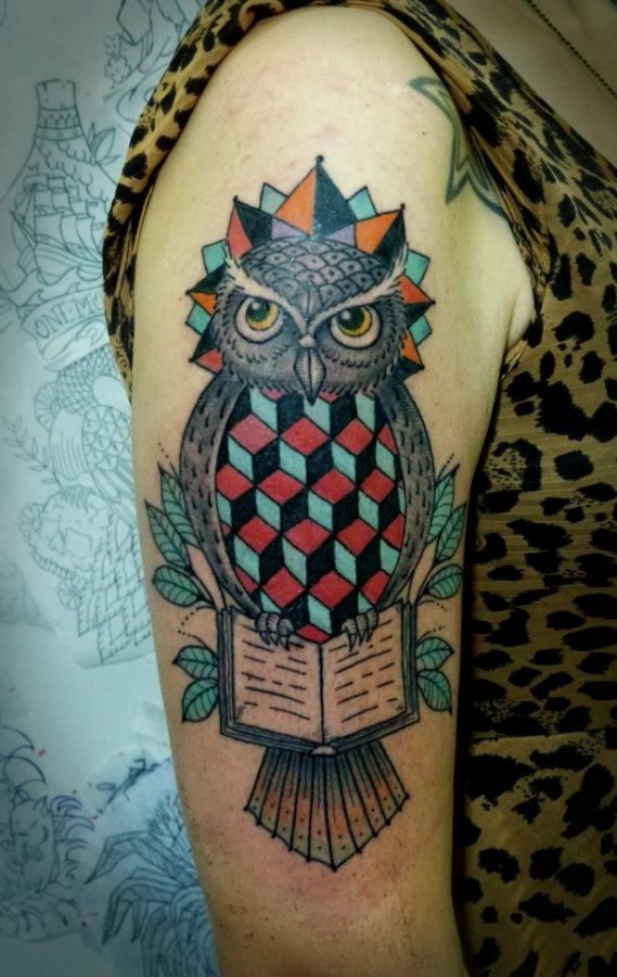 Geometric owl arm tattoo by Tyago Compiani