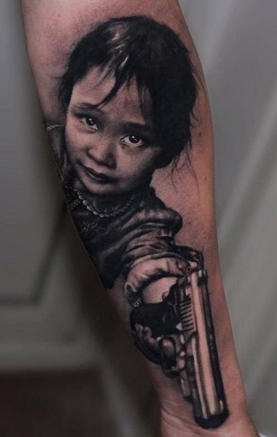 Girl with a gun tattoo by Riccardo Cassese