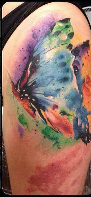 Girl’s shoulder watercolor butterfly tattoo