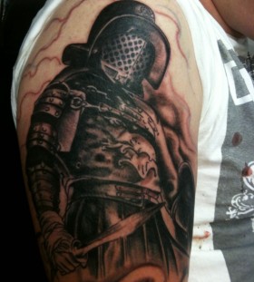 Gladiator with a sword tattoo