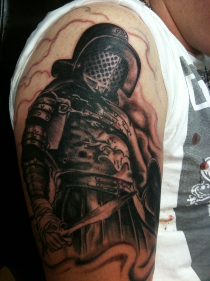 Gladiator with a sword tattoo