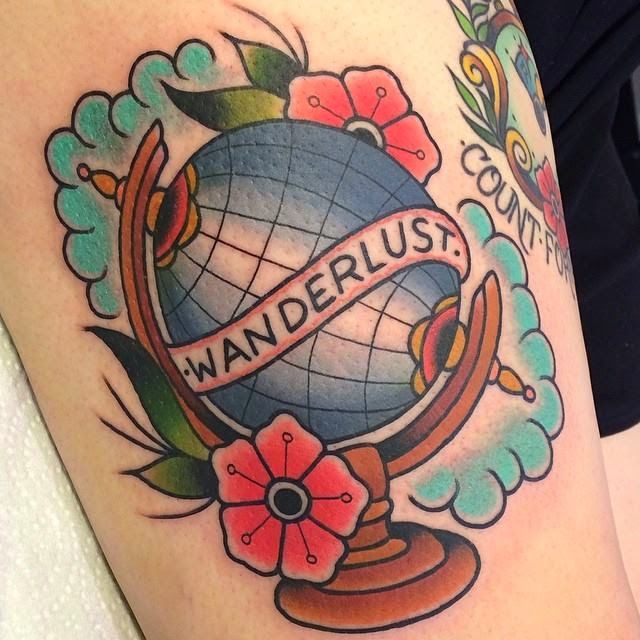 Globe and flowers tattoo by Clare Hampshire