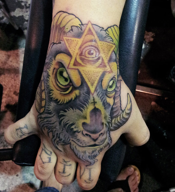 Goat and triangle eye tattoo