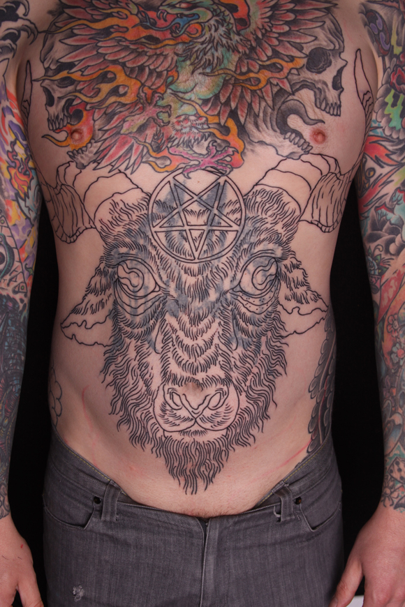 Goats’ head stomach tattoo