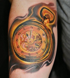 Golden pocket watch tattoo